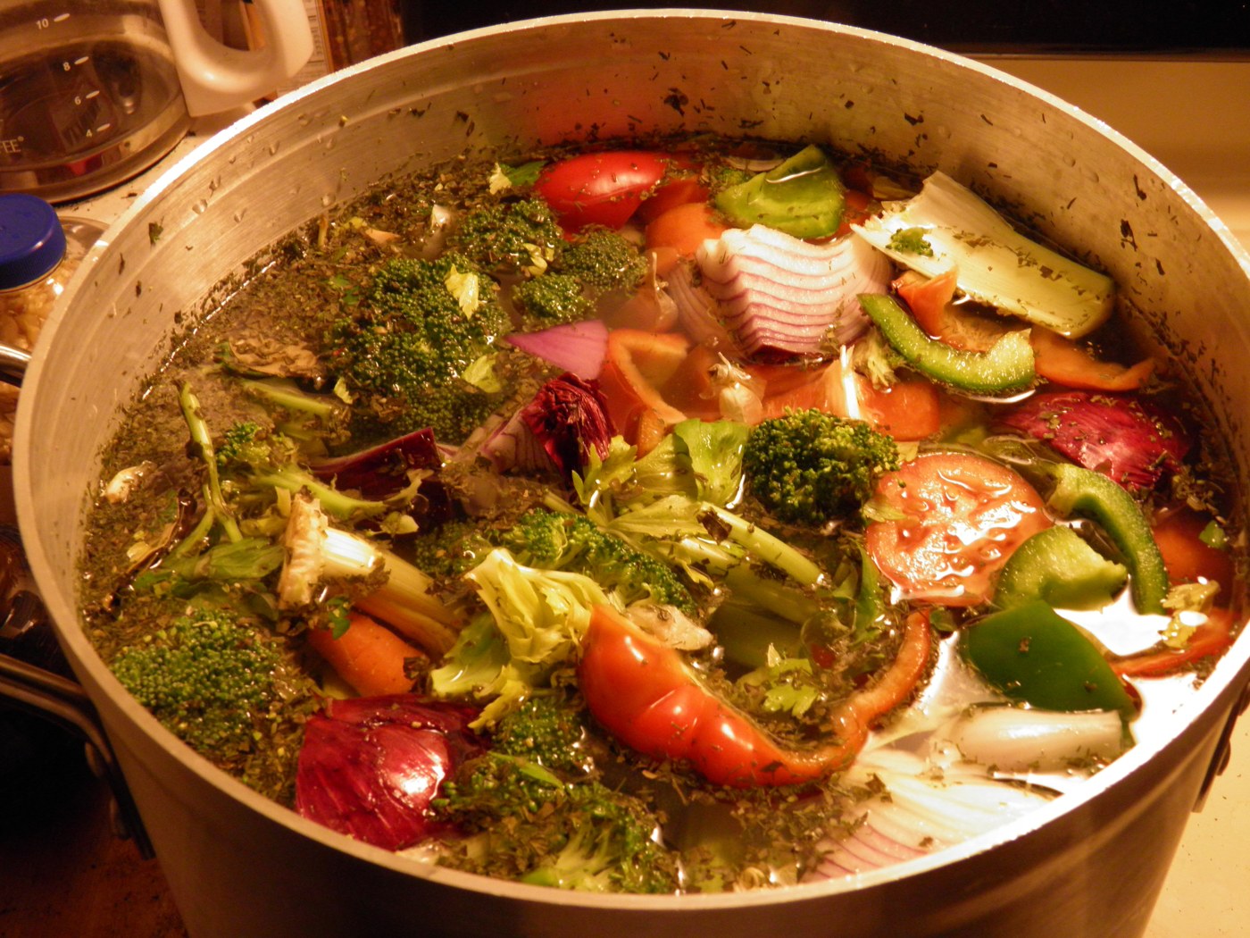 A pot of soup on the stove